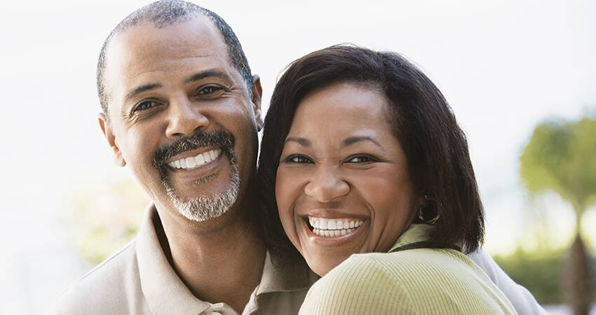 Couple smiling and hugging