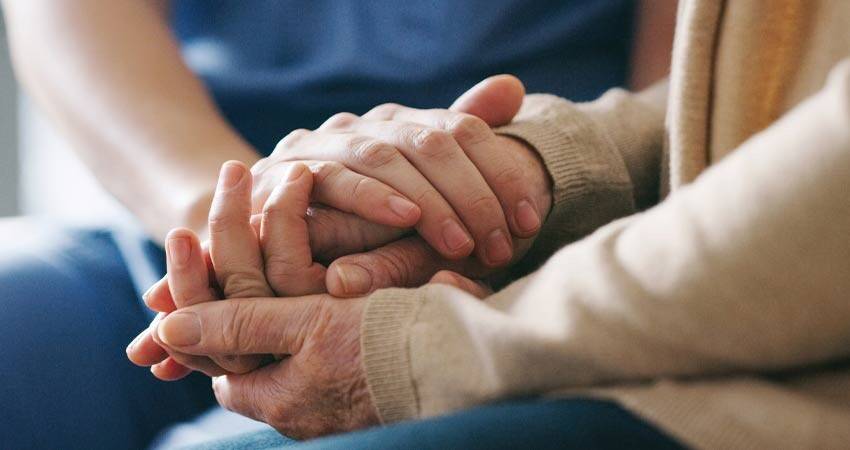 Couple holding their hands