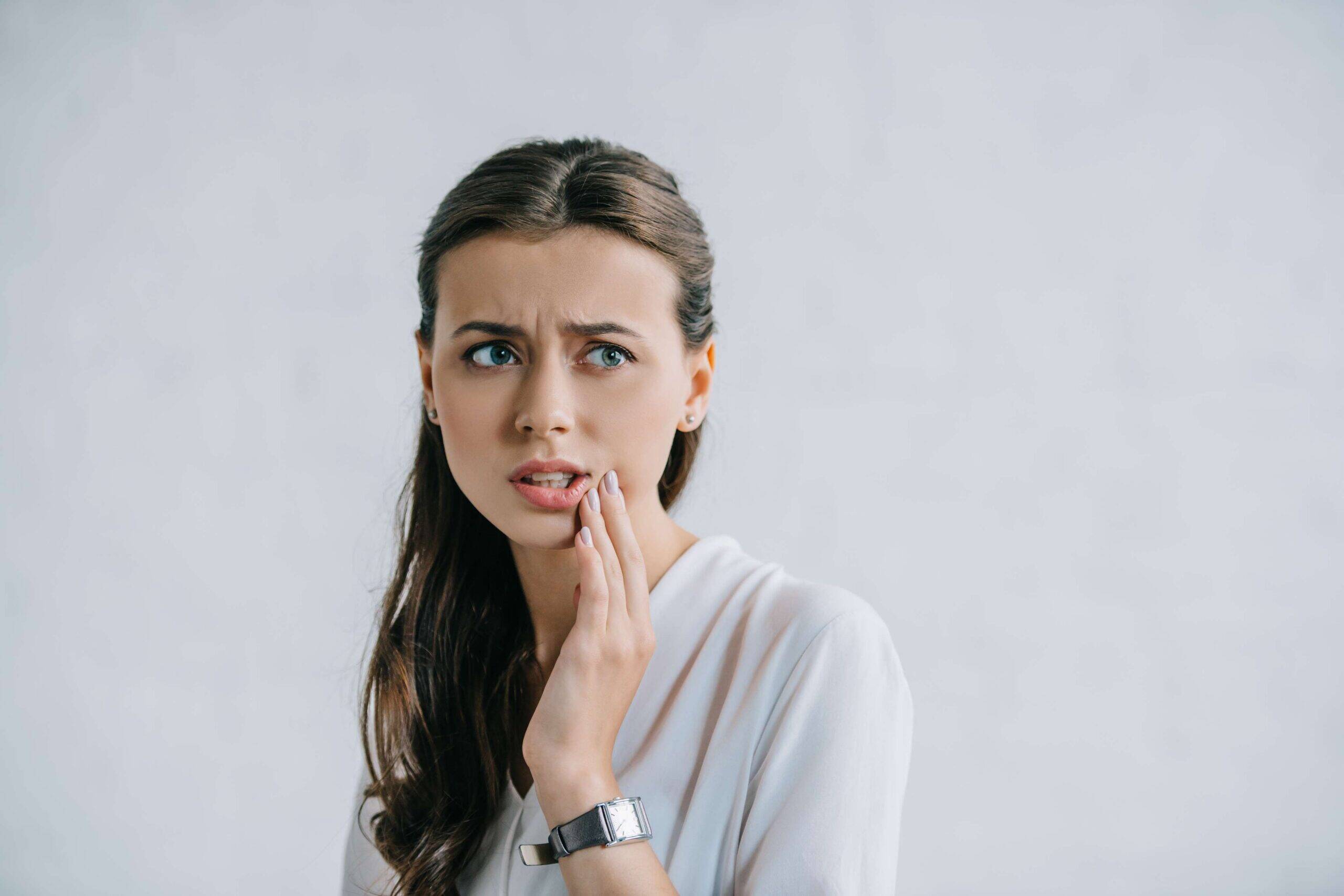 Woman with teeth pain.