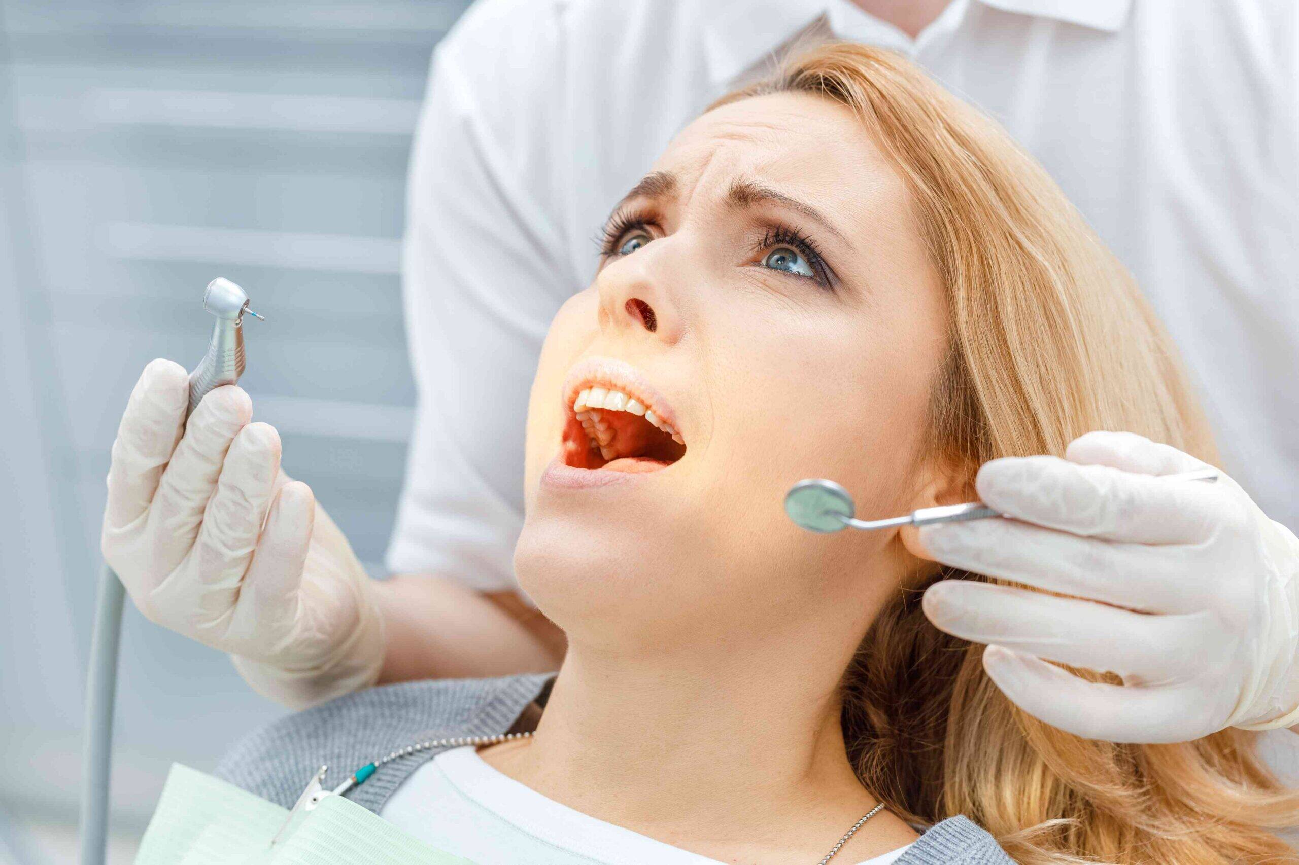 Patient receiving a dental crown examination.