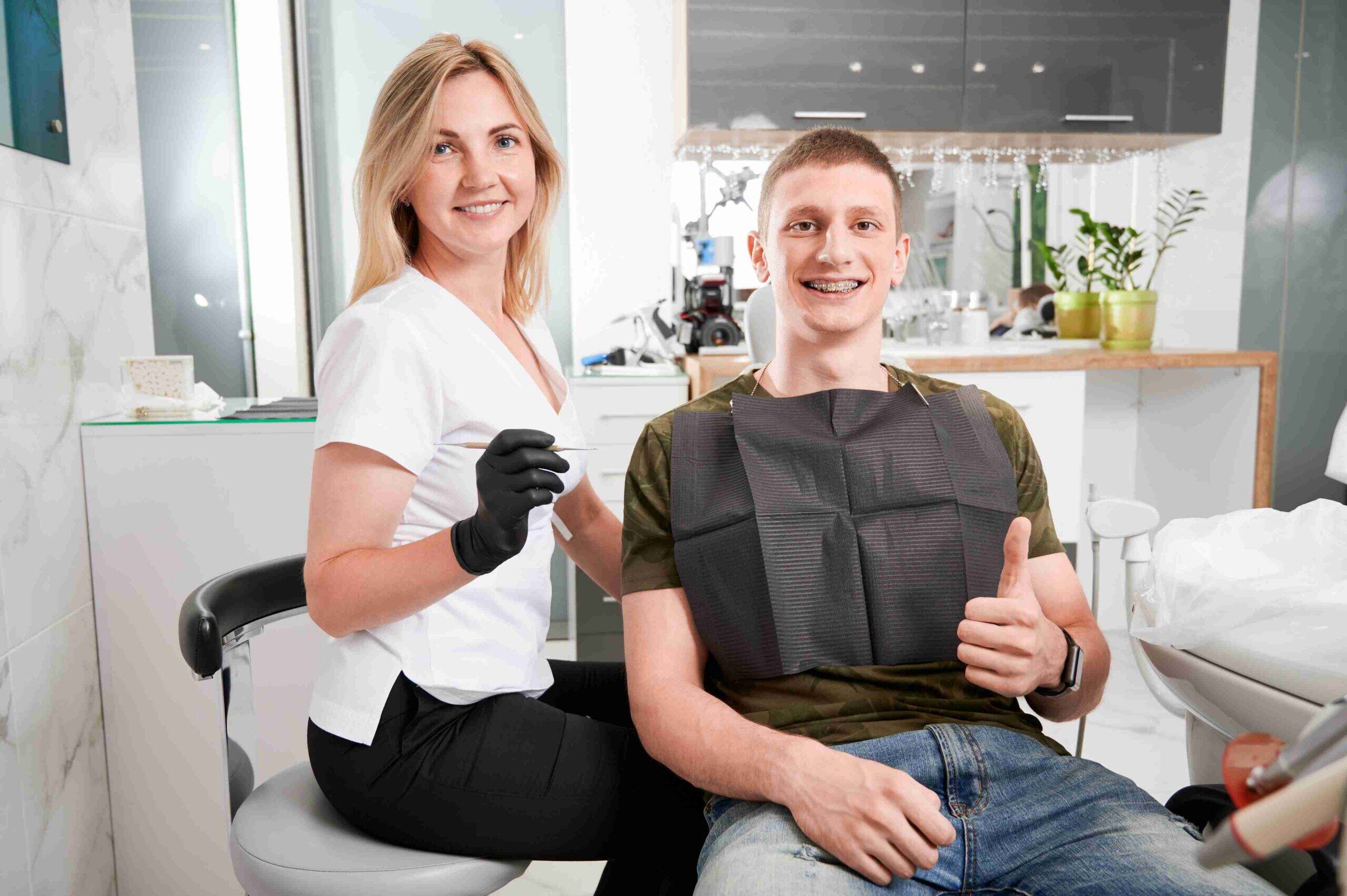 Patient smiling after a dental checkup.